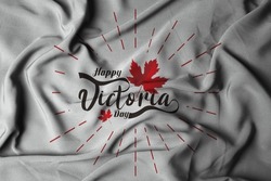 Selective focus of happy victoria day greeting card with wavy fabric texture. 3D illustration