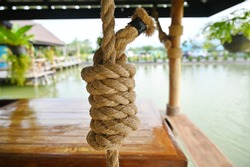 Manila or polypropylene rope is strongly braided into a spiral neatly wrapped with black masking tape. Used for hanging heavy objects or decorating a wooden pavilion in the water to be beautiful.