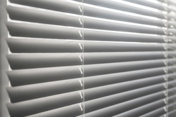 Horizontal blinds close-up. Closed office blinds on the windows. Metal blinds on the windows.