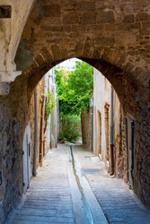Exterior view of the Passage Jules-Romains, an old Renaissance period covered alley located in the old medieval town of Hyères, France