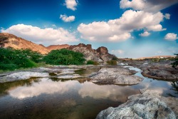 HDR Landscape of Oman. wadi al khoud muscat Oman. Reflection view of Cloud and rock waterfall