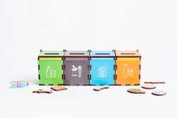 environmentally friendly garbage sorting board game, the selective focus is isolated on a white background. The game garbage cans for sorting garbage, teaching children