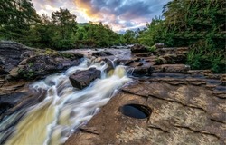 River rapids of the forest river. Forest river landscape. River rapids in forest. Rive rapids landscape