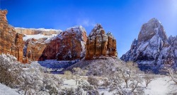 The rocks of the mountain canyon in the snow in winter. Snowy canyon rocks. Canyon rock in snow. Canyon snowy rocks landscape