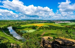 River valley with agricultural fields. Cloudy sky over summer agriculture fields. Agricultural fields in summer. Agricultural field landscape