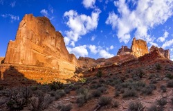 Red rocks in the canyon desert. Canyon desert scene. Rocks in canyon desert. Canyon desert rocks landscape