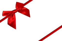 Red silk ribbon and a big bow isolated on white background