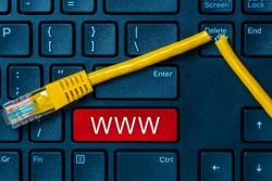 Internet or online concept with www on computer keyboard and  cut internet cable. Internet censorship and interruption.