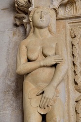 Eve with a fig leaf on the western gate of Trogir Cathedral or Cathedral of St. Lawrence, 13th century, by the artist Radovan, historic centre, Unesco World Heritage Site, Trogir, Dalmatia, Croatia