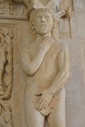 Adam with a fig leaf on the western gate of Trogir Cathedral or Cathedral of St. Lawrence, 13th century, by the artist Radovan, historic centre, Unesco World Heritage Site, Trogir, Dalmatia, Croatia