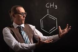 Professor presenting handdrawn chemical formula of toluene molecule