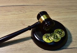 Judge hammer and BTC gold crypto coin. Justice courtroom. Ripple demands Bitcoin and Ethereum docs from SEC amid legal fight. Delist сryptocurrency trading. Exchanges and traders. law to ban

