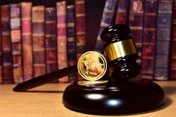 Judge hammer and XRP crypto coin. Justice courtroom. Ripple demands Bitcoin and Ethereum docs from SEC amid legal fight. Delist сryptocurrency trading. Exchanges and traders. law to ban blockchain