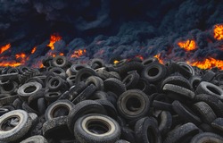 Tyres are on fire. Burning old tyres on recycling landfill. Black smoke from tires fire. Tyre graveyard at rubber burning plant. Wheel tire recyclers, tyre for reuse. Pile of old wheels in blaze.