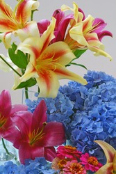 Small flower bouquets with lilies, hydrangea and zinnias