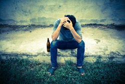 Drunk man with bottle,Sad,Despair,Depressed,Vintage sepia