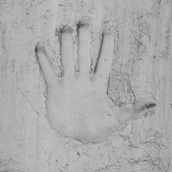 Human hand print in cement. Concrete background. Human power and Labor day concept.