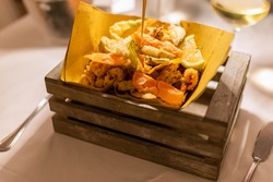 Typical Italian appetizer (Fritto misto di pesce) mix of fried seafood