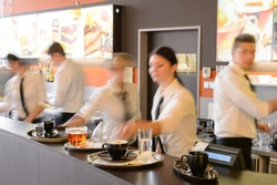 5 Best Practices To Handle Labour Shortage Successfully In Your Restaurant 2 Busy waiter and waitresses working at bar night