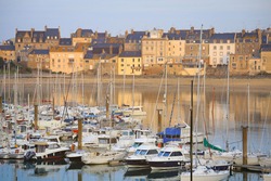 Yachts and houses with it's reflection in the port of Saint Malo, Normandy, France