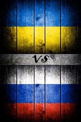 Ukrainian flag vs Russian on a wooden background.
ukraine russia conflict 2021 escalation
