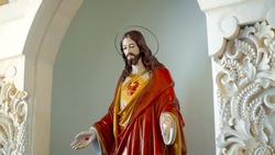 Statue of Jesus in the church stay near the wall