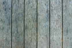 Old textured discoloured wooden boards Old textured discoloured wooden boards arranged vertically.