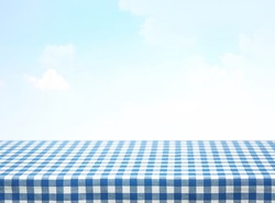 Blue checkered tablecloth empty advertisement space. Food promotion table.Product display. Picnic backdrop. Tabletop.