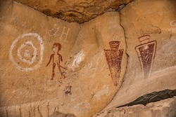 Fremont culture petroglyphs and pictographs intermingle with newer etchings from pioneer settlers on the walls of Sego Canyon, located near Moab, Utah, United States.