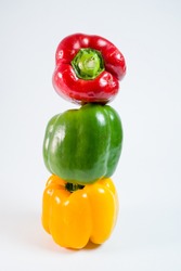 Colorful close up of whole bell pepper isolated on white background. Concept table top cooking lifestyle.