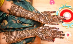 Indian bride showing hands mehndi design