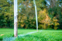 An old rusty abandoned football (soccer) goal on an english park symbolizing the death of grass roots sunday league football in the UK as a result of Covid-19 Coronavirus