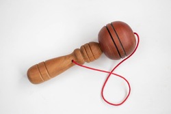 Ball in a cup toy on a white background