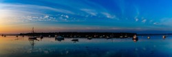 Panoramic image of the harbor at St. Andrews, New Brunswick Canada.  Sunrise shot of boats waiting for the day.