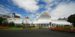 the botanic gardens in belfast under a dramatic sky line