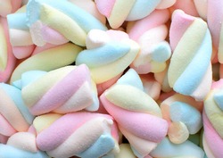 Multi-colored marshmallows. Background or texture of colorful blue and pink marshmallows. 