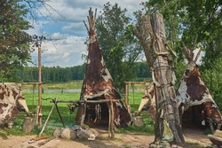 layout of the parking lot of ancient people, wigwams, bonfire, animal skins, totem pole