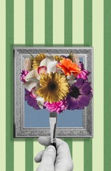 A hand holds an artistic brush with a bouquet of flowers in a frame. Modern design. Conceptual, modern bright art collage. surrealism.