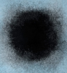 A frame of a frosty pattern on a black background. A round frame with an abstract ice structure allows you to apply or add a frost effect. Frost on the glass, freezing effect