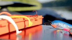 a box of fishing lures in a fishing boat. High quality photo