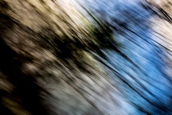 Hazy, veiny, blue and creamy-white light streak pattern with heavy, hazy, veiny shadows - abstract, motion-blurred background texture