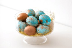 Glass vase with turquoise and gold Easter eggs
