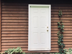 White door brown house Vine
