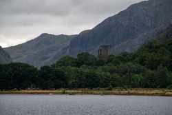  View of Dolbadarn Castle from across the water at Llyn Padarn. Below Snowdon in Snowdonia National Park, north Wales