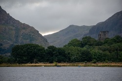  View of Dolbadarn Castle from across the water at Llyn Padarn. Below Snowdon in Snowdonia National Park, north Wales