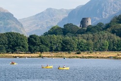View of Dolbadarn Castle from across the water at Llyn Padarn. Below Snowdon in Snowdonia National Park, north Wales
