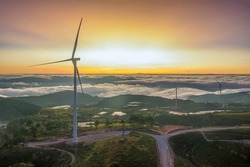 Aerial view of windmill or wind farm in fog  at Cau Dat town, Da Lat city, Lam Dong, Vietnam