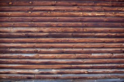 wooden wall of log house as background