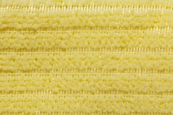 Fabric yellow striped background. Soft fiber texture of interlaced polyester. fine grain fabric.