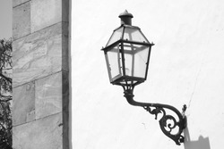 Old cast iron lamp on colonial building wall, Tiradentes city, Minas Gerais, Brazil